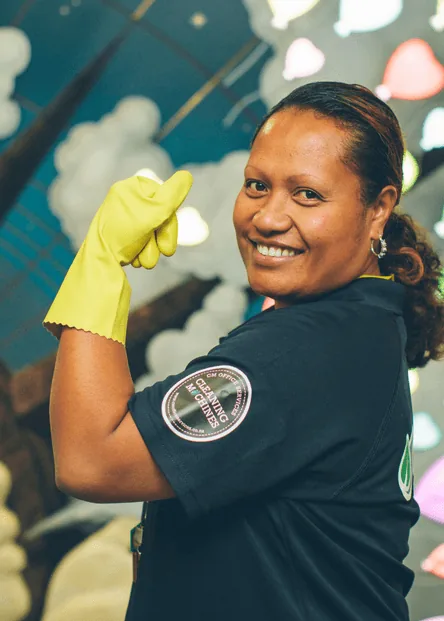 Two CMOS cleaners in uniform working together in a client workplace
